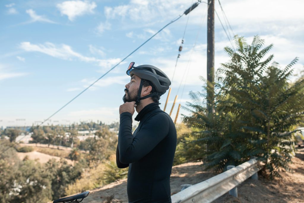 Evaluate Fit (Man Putting Helmet On)